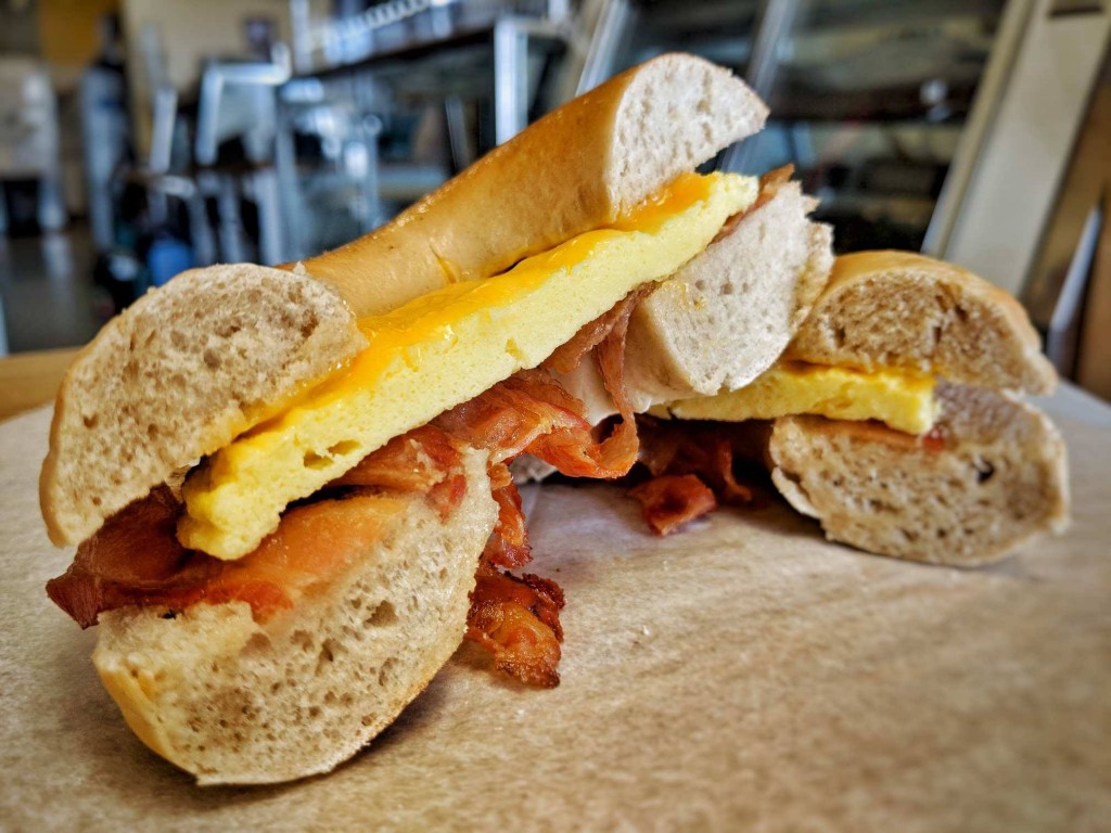 Homemade New York style bagel topped with bacon, egg and cheese.